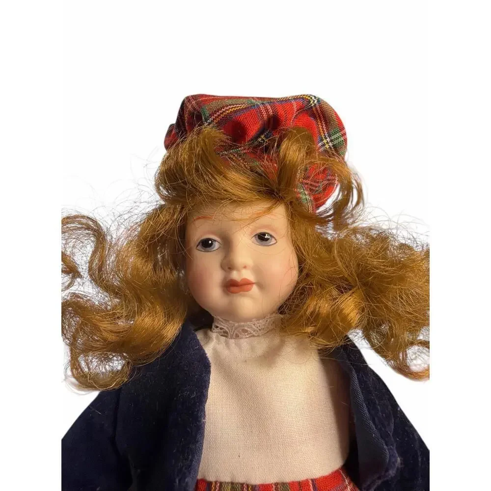 Doll porcelain Danbury Mint.  The doll is dressed in traditional Scottish attire
